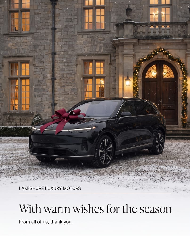 Holiday greeting: With warm wishes for the season, a black SUV with a red bow at a snowy stone estate